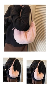 Detail of light pink faux fur shoulder bag with leather strap and soft plush texture