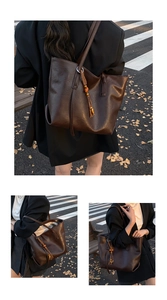 Close-up of retro brown tote bag with stylish wooden bead tassel charm detail