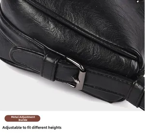 Detail shot of black litchi texture leather bag with gunmetal adjustable strap buckle