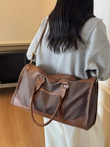 Large travel bag in brown waterproof nylon with adjustable shoulder strap for fitness