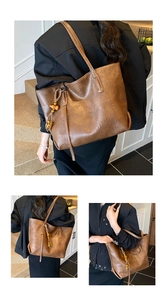 Detail of dark brown tote bag featuring premium PU leather texture and wooden bead tassels