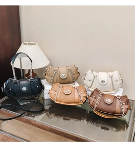 Detail of five vintage chain handbags in textured leather with silver metal closures