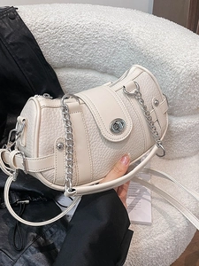 Vintage style warm white lychee leather handbag with silver chain and twist lock closure