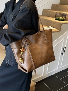 Retro brown large capacity PU leather tote bag with stylish wooden bead tassel for women