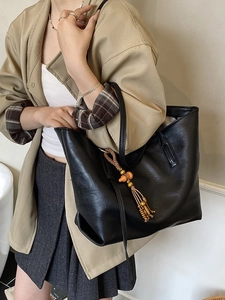 Minimalist black PU leather large tote bag with vintage wood bead tassel for women