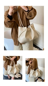 Detail der cremeweißen Tragetasche mit Knotendesign und weicher Textur im Lifestyle-Kontext