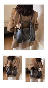 Dettaglio della borsa tote vintage in pelle PU con fibbia tonda e ciondolo a pecora