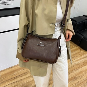 Dark brown faux leather crossbody bag for women with vintage pleated texture and metal logo