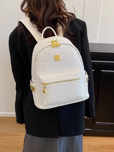 Elegant cream tweed backpack with gold zipper and rivets for women in high-end style