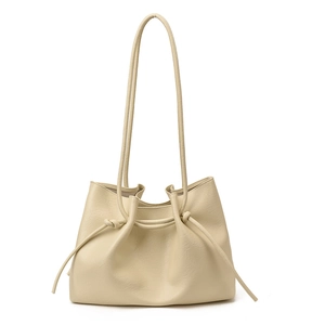 Minimalist beige tote bag for women with knot drawstring detail and thin shoulder straps