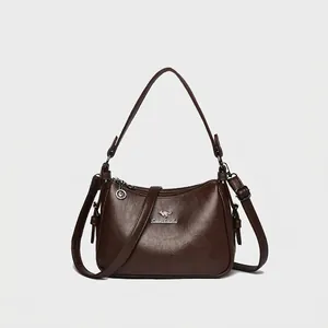 Brown litchi grain leather handbag for women with adjustable crossbody shoulder strap