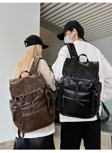 Detail of vintage PU leather backpack with buckle straps and large capacity for travel