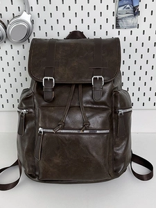 Deep brown vintage PU leather backpack with silver hardware for travel and commuting