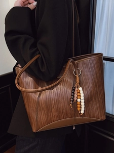 Chic dark brown woven tote bag for women with decorative beads and slim handles
