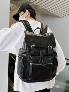 Chic black PU leather backpack for women featuring flap cover and multiple zipper pockets