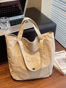 Minimalist beige large capacity tote bag with front pocket for stylish daily commute