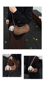 Close-up of leopard print shoulder bag with cute rabbit charm and brown strap