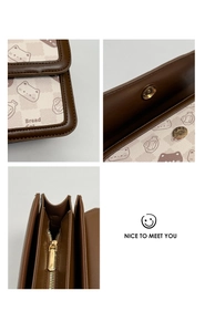 Detail view of Bread Cat bag showing magnetic closure and interior storage compartments