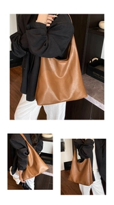Detail of caramel tote bag showing supple leather texture and large storage capacity