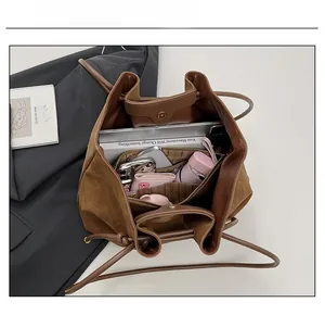 Top view of brown tote bag interior showing spacious compartments for tablet and essentials