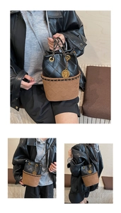 Close-up of quilted bucket bag featuring chain strap and gold coin charm detail
