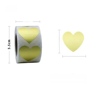 Detail view of 2.5cm gold heart adhesive labels on a roll with 500 stickers per pack
