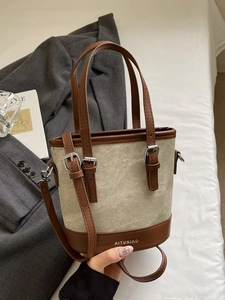 Sac seau vintage en toile et cuir marron avec poignée et bandoulière réglable