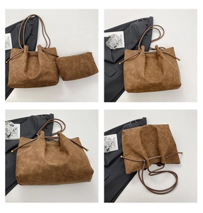 Detail of vintage brown tote bag with metal ball accents and matching small pouch