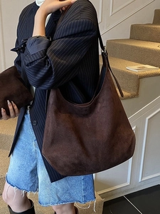 Deep brown suede large capacity hobo tote bag for women showing a stylish city commute look