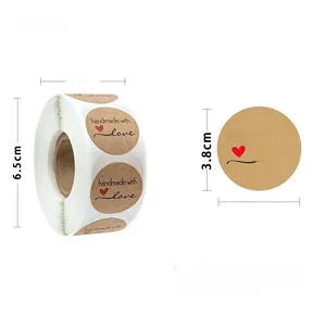 Detail of 3.8cm round kraft stickers with handmade with love print and red heart design