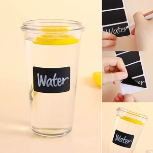Detailed view of writing and peeling reusable blackboard stickers for kitchen storage jars