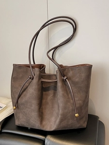 Retro dark brown large capacity tote bag with drawstring and gold metal accents
