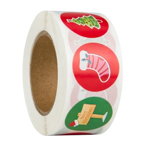 Detailed macro view of a roll of round Christmas stickers with festive holiday designs