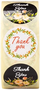 Close-up of Thank You floral adhesive labels in black and white rolls for DIY decor