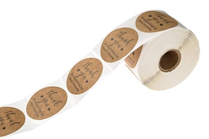 Detail of kraft paper thank you stickers roll for small business packaging