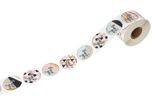 Macro detail of round Thank You roll stickers with pink, gold, and geometric patterns