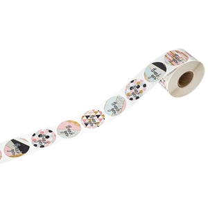 Roll of assorted thank you stickers with gold and pink floral designs for packaging