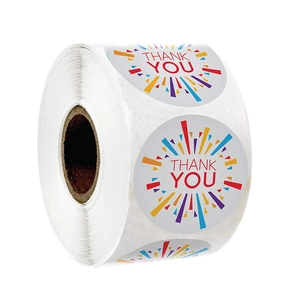Roll of round white Thank You stickers with colorful radial lines and red text