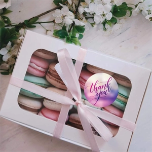 Macaron gift box with pink ribbon and circular 'Thank You' adhesive sealing sticker