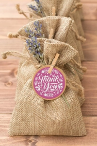 Floral Thank You stickers on linen favor bags with lavender sprigs for weddings