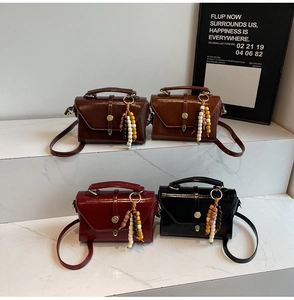 Set of luxury faux leather shoulder bags in four colors with beaded tassel details