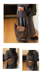 Detail shot of leopard print bucket bag with leather flap and adjustable strap