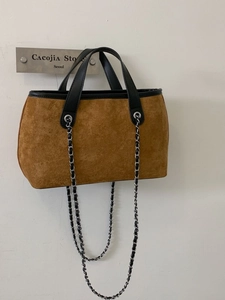 Vintage brown suede tote bag with black leather handles and metal chain shoulder strap