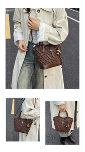 Detail of dark brown woven texture handbag featuring decorative multi-colored wooden beads