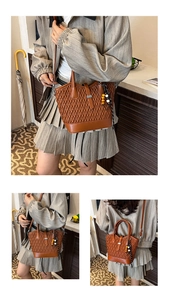 Detail view of brown woven texture PU leather handbag with vintage beads and crossbody strap