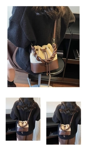 Close-up of vintage bucket bag featuring braided handle and drawstring closure details