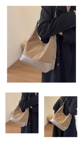 Detail of khaki hobo bag showing suede stitching and silver metal logo on bottom