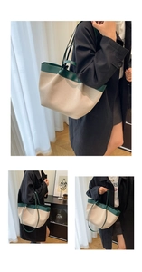 Detail view of canvas patchwork tote bag with green leather straps in lifestyle setting