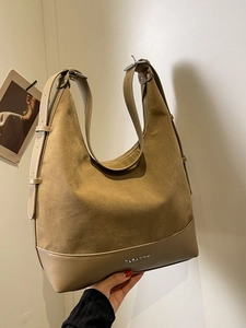 Large camel suede tote bag with leather trim and metal logo for casual daily commute