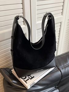 Large black suede tote bag with leather拼接 details and adjustable silver-buckled strap